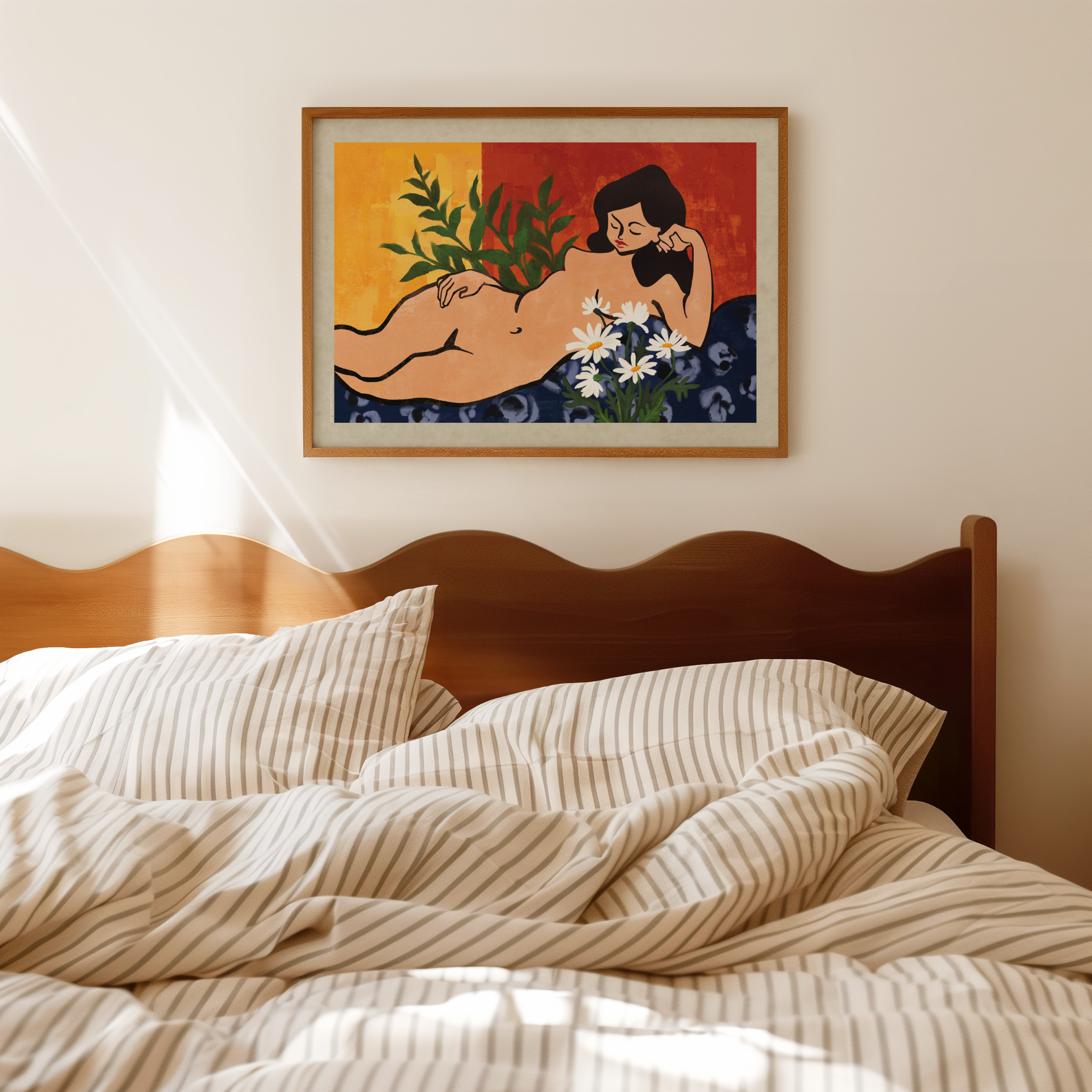 A framed botanical art print featuring a graceful reclining woman surrounded by lush green leaves and delicate white flowers hangs on a warm beige wall above a wooden bed with striped bedding. The calming artwork celebrates feminine beauty, nature, and self connection, creating a peaceful focal point for a cozy bedroom or mindful living space.
